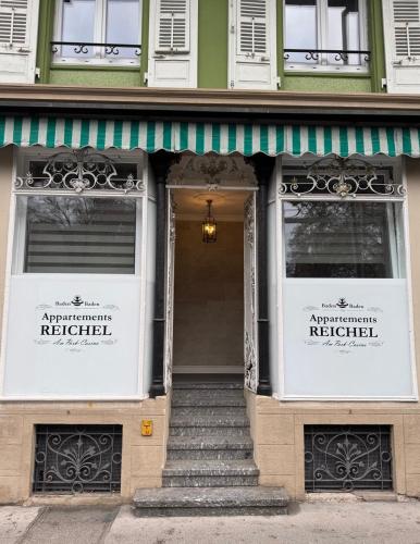 a front door of a building with a sign for an antipolis kitchen at eco Appartements Reichel in Baden-Baden