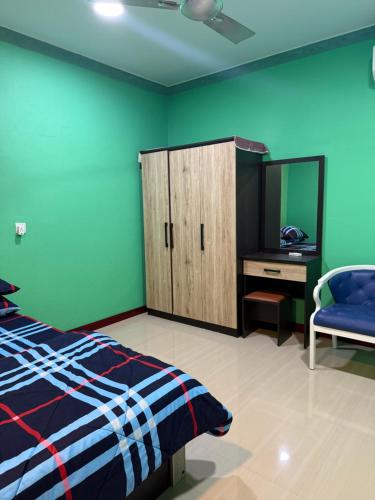 a bedroom with a bed and a cabinet and a mirror at Coconut Palm Dhidhoo in Ariyaddu