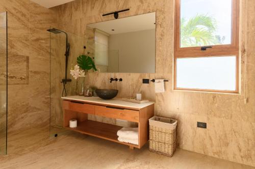 a bathroom with a sink and a mirror at New! Gorgeous Portillo Beach Villa W Pool & Staff in Abra Grande