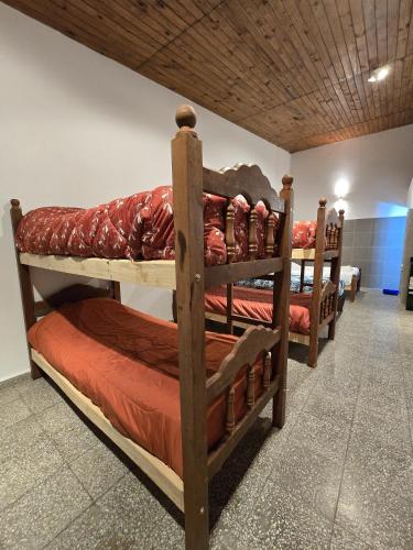 En eller flere senge i et værelse på Hospedaje 46