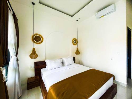 Postel nebo postele na pokoji v ubytování Sundari Guesthouse Pererenan