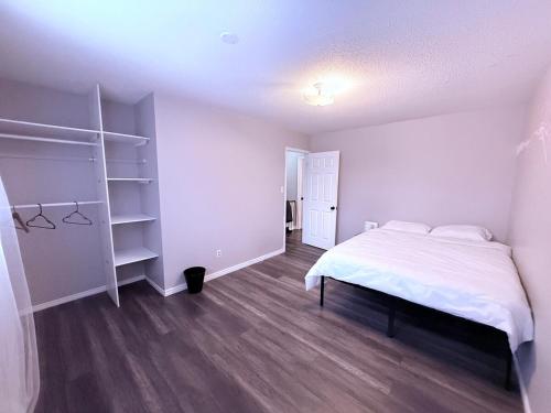 a bedroom with a bed and a book shelf at Cozy Belleville Retreat Near DT & Waterfront in Belleville