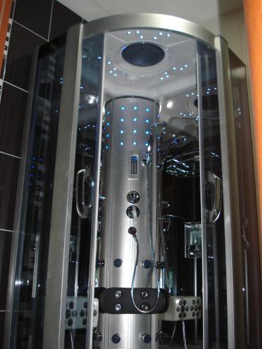 a large glass room with a shower in a building at Villa Vežić in Mostar