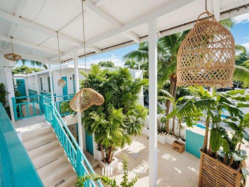 a view of the lobby of a resort with palm trees at SunSeaSurf Maldives in Thulusdhoo