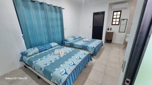 Ein Bett oder Betten in einem Zimmer der Unterkunft Casa Gemelas