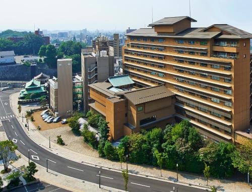 an overhead view of a city with a building at Yamatoya Honten in Matsuyama