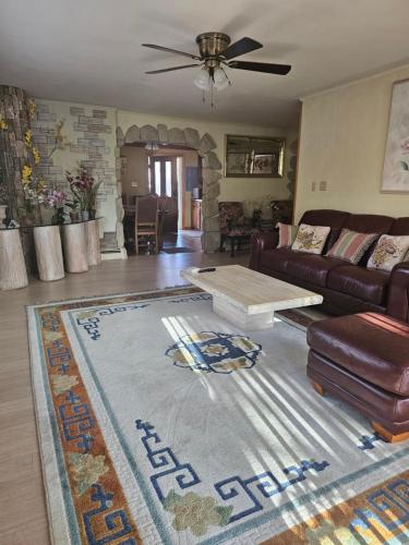 a living room with a couch and a table at Your comfortable stay in Colorado Springs in Colorado Springs