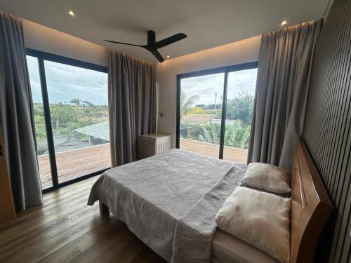 Ένα ή περισσότερα κρεβάτια σε δωμάτιο στο Villa Sun