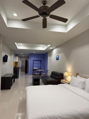 Ένα ή περισσότερα κρεβάτια σε δωμάτιο στο Subjomtien Pattaya Residences