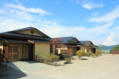 a house with a driveway in front of it at Bessou Kakei in Morioka