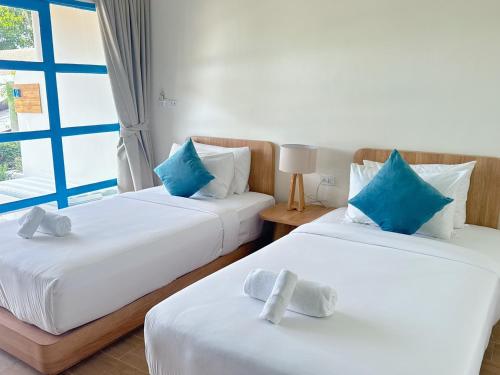 Postel nebo postele na pokoji v ubytování Kerala Coco Resort