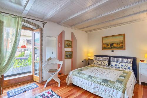 a bedroom with a bed and a window at Rivabella Apartment in Poreč