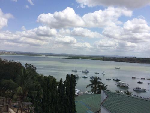 a view of a large body of water with boats in it at Tudor Water Sports Hotel in Mombasa