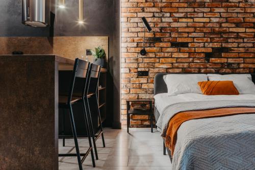 Voodi või voodid majutusasutuse Walońska 19 - Luxury Loft Apartment - siłownia, sauna, self-check in - Fair Rentals toas