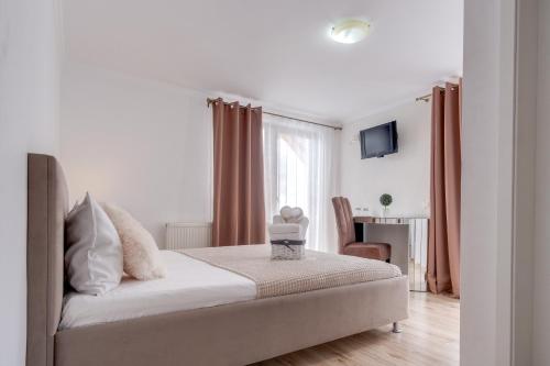 Ένα ή περισσότερα κρεβάτια σε δωμάτιο στο Oana Boutique C D I