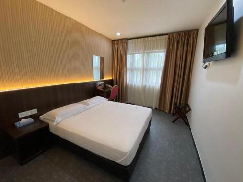 TV a/nebo společenská místnost v ubytování ID Hotel Segamat