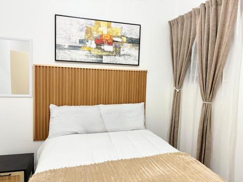 Postel nebo postele na pokoji v ubytování Bonno Apartment