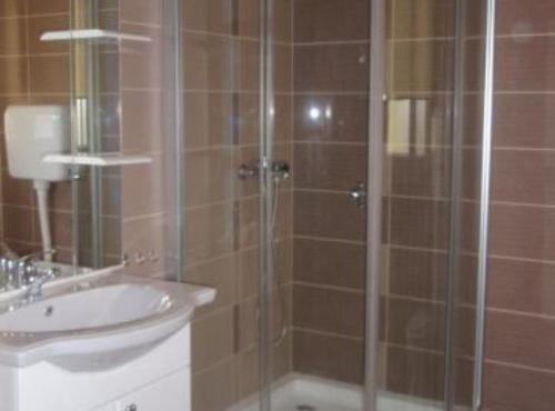 a bathroom with a shower and a sink at Apartments Snježana in Sali