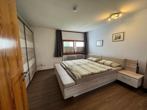 Postel nebo postele na pokoji v ubytování Ferienwohnung Ulbricht mit aktivCARD