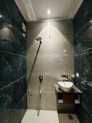 a bathroom with a sink and a shower at Hotel Cloud 9 in Amritsar
