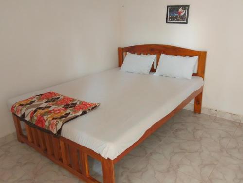 Ένα ή περισσότερα κρεβάτια σε δωμάτιο στο NARESH Holiday Home