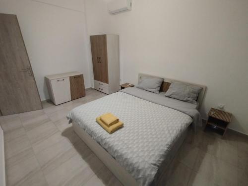 Postel nebo postele na pokoji v ubytování Kilkis Topfloor Apartment