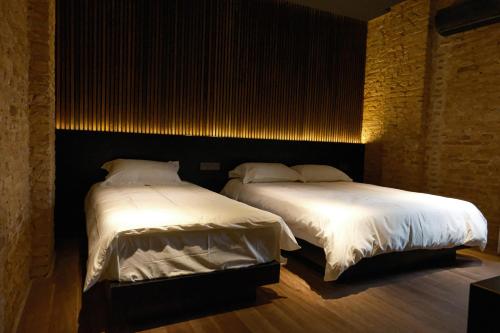 Ένα ή περισσότερα κρεβάτια σε δωμάτιο στο Playce Hotel