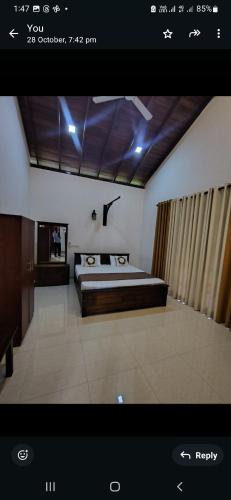 a bedroom with a bed in a room at Royal Villa Polhena in Matara