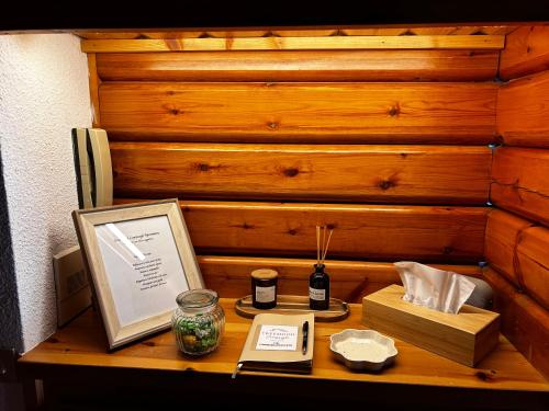 a wooden table with a picture and a box at FreeMood Campaegli in Campaegli