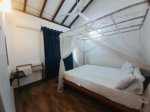 Postel nebo postele na pokoji v ubytování Nisadi Villa