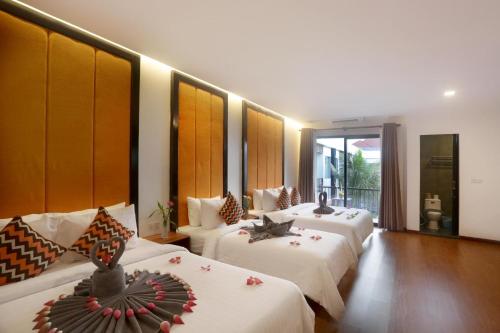 Voodi või voodid majutusasutuse Central Corner Suite toas