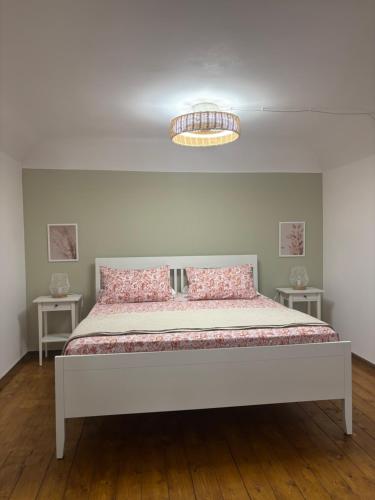 a bed in a room with two tables at Sicily Loft Living in Catania