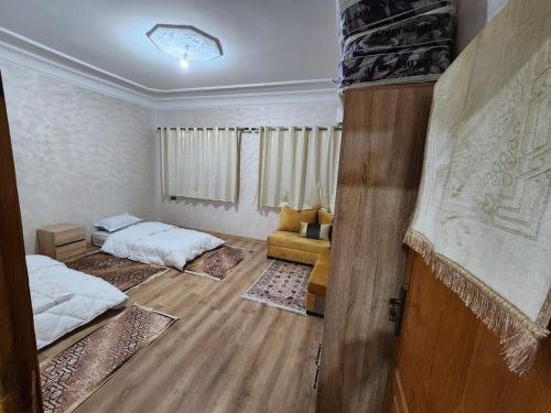 Ένα ή περισσότερα κρεβάτια σε δωμάτιο στο Aappartement laayoune Achifaa