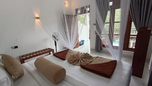 Ένα ή περισσότερα κρεβάτια σε δωμάτιο στο The Cloud Heaven Ella