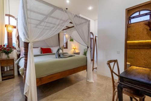 Postel nebo postele na pokoji v ubytování The Green Atelier Bali