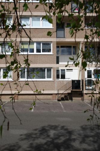 an empty parking lot in front of a building at Southside Apartment Glasgow in Glasgow