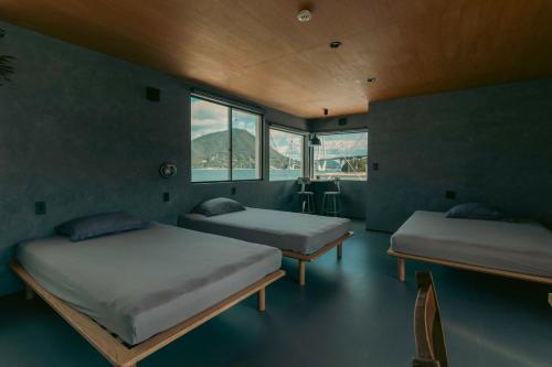 Ένα ή περισσότερα κρεβάτια σε δωμάτιο στο TATARA FACTORY stay