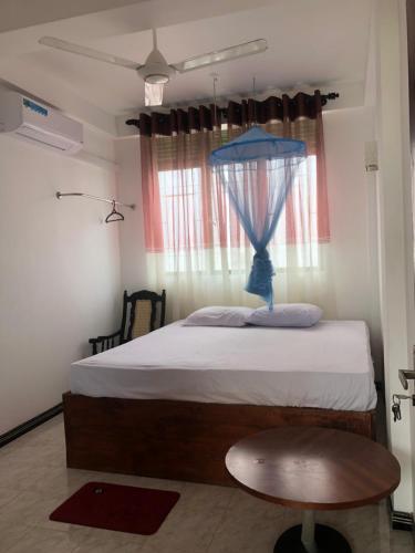 Postel nebo postele na pokoji v ubytování senarathna guest house