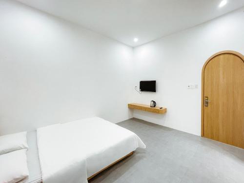 Un televizor și/sau centru de divertisment la Quy Nhơn - KTK Homestay