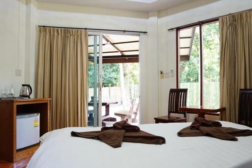 Voodi või voodid majutusasutuse Avare House Krabi toas