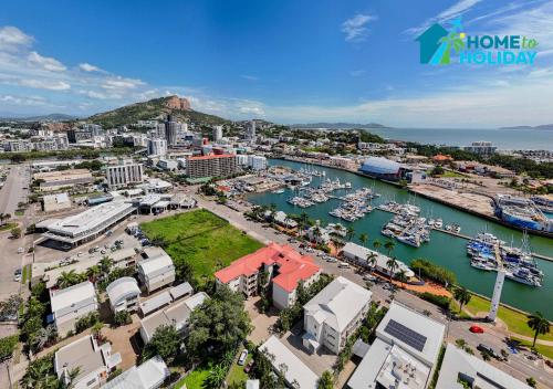an aerial view of a harbor with boats in the water at Waterfront Studio Room Near City Stadium & Ferry in Townsville in Townsville