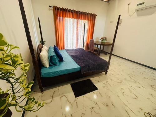 Ένα ή περισσότερα κρεβάτια σε δωμάτιο στο The TJ Lanka