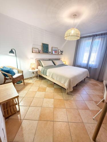 a bedroom with a bed and a tiled floor at Casa Montebello in Camaiore