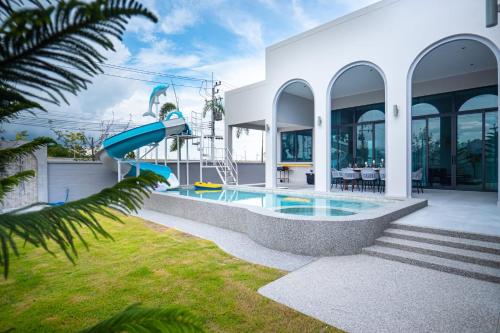a house with a pool and a slide at Triple P พูลวิลล่า ชะอำ in Ban Bo Prakhon