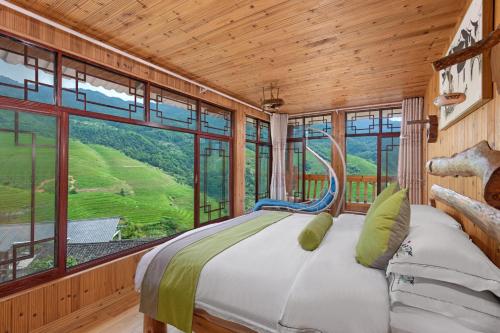 Postel nebo postele na pokoji v ubytování Longji Terrace La vie Inn