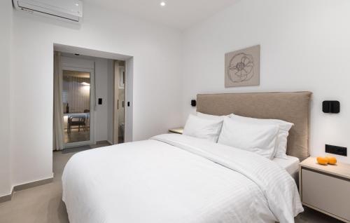 Ένα ή περισσότερα κρεβάτια σε δωμάτιο στο Thessaloniki Spot by Luxlikehome