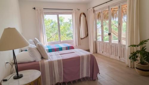 Ένα ή περισσότερα κρεβάτια σε δωμάτιο στο Casa Cerritos