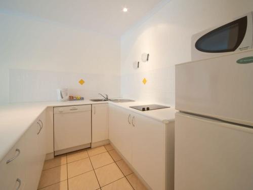 Kuchyň nebo kuchyňský kout v ubytování Coconut Cove