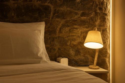 Ένα ή περισσότερα κρεβάτια σε δωμάτιο στο JoLi Larano - BBQ In