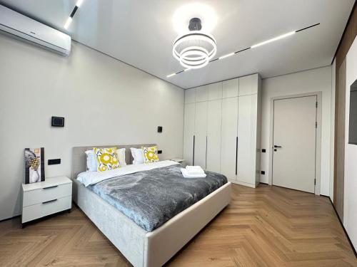 En eller flere senge i et værelse på ЖК METROPOLE Business